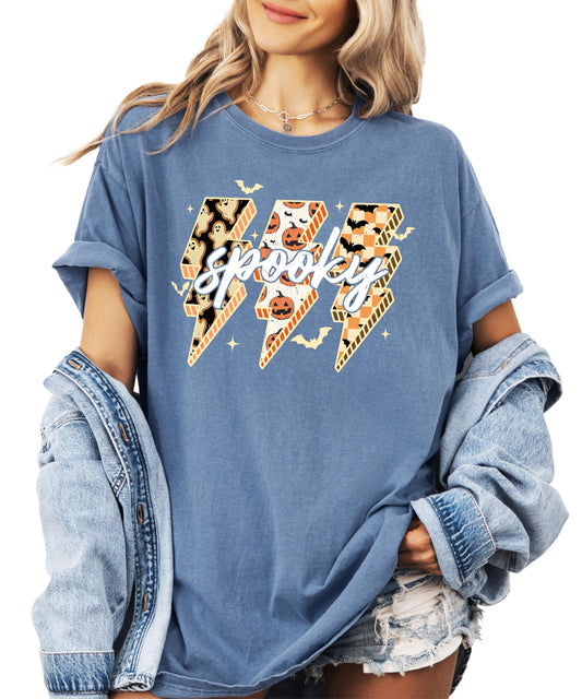 Front view of Spooky Halloween graphic tee with bold lightning bolt filled with pumpkins, bats, and ghosts on dark brown shirt