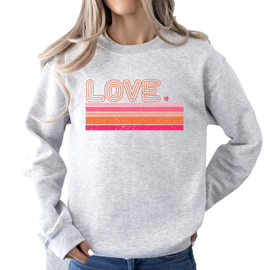 Close-up of retro-style Love Valentine's Day graphic print on gray sweatshirt