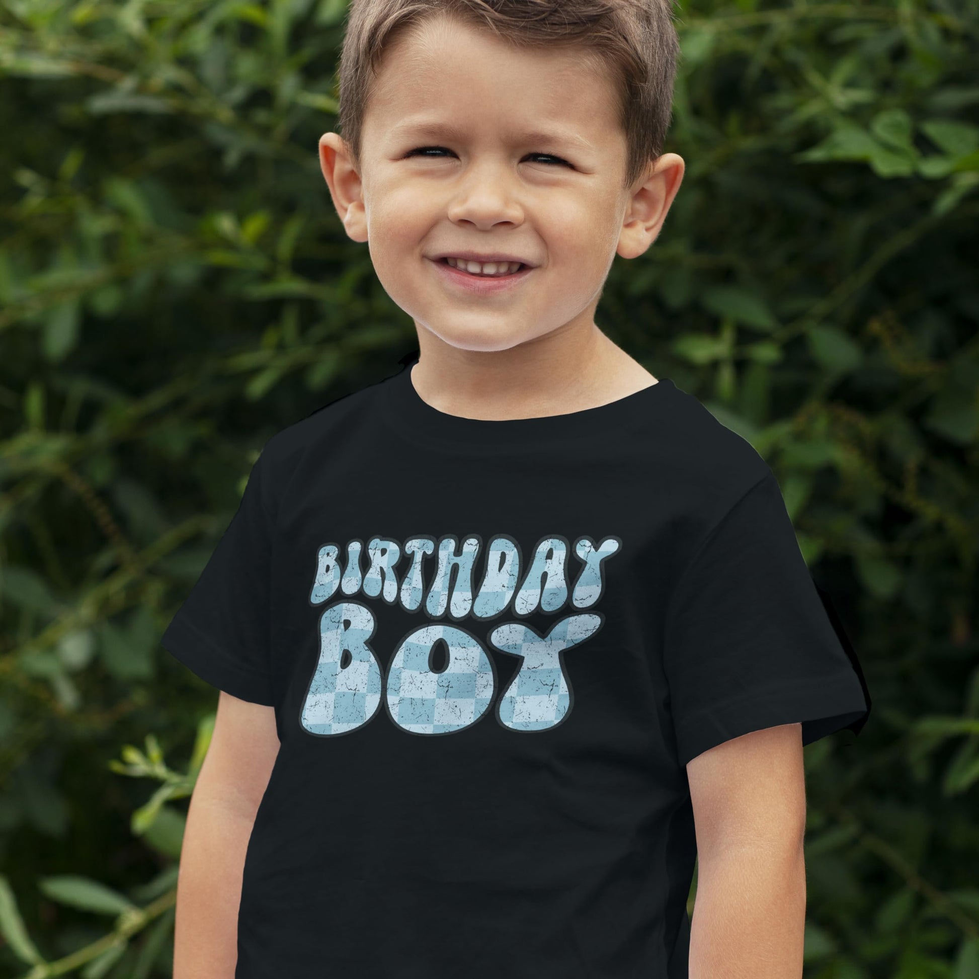 Flat lay of black groovy birthday boy shirt for infants and toddler youth boys