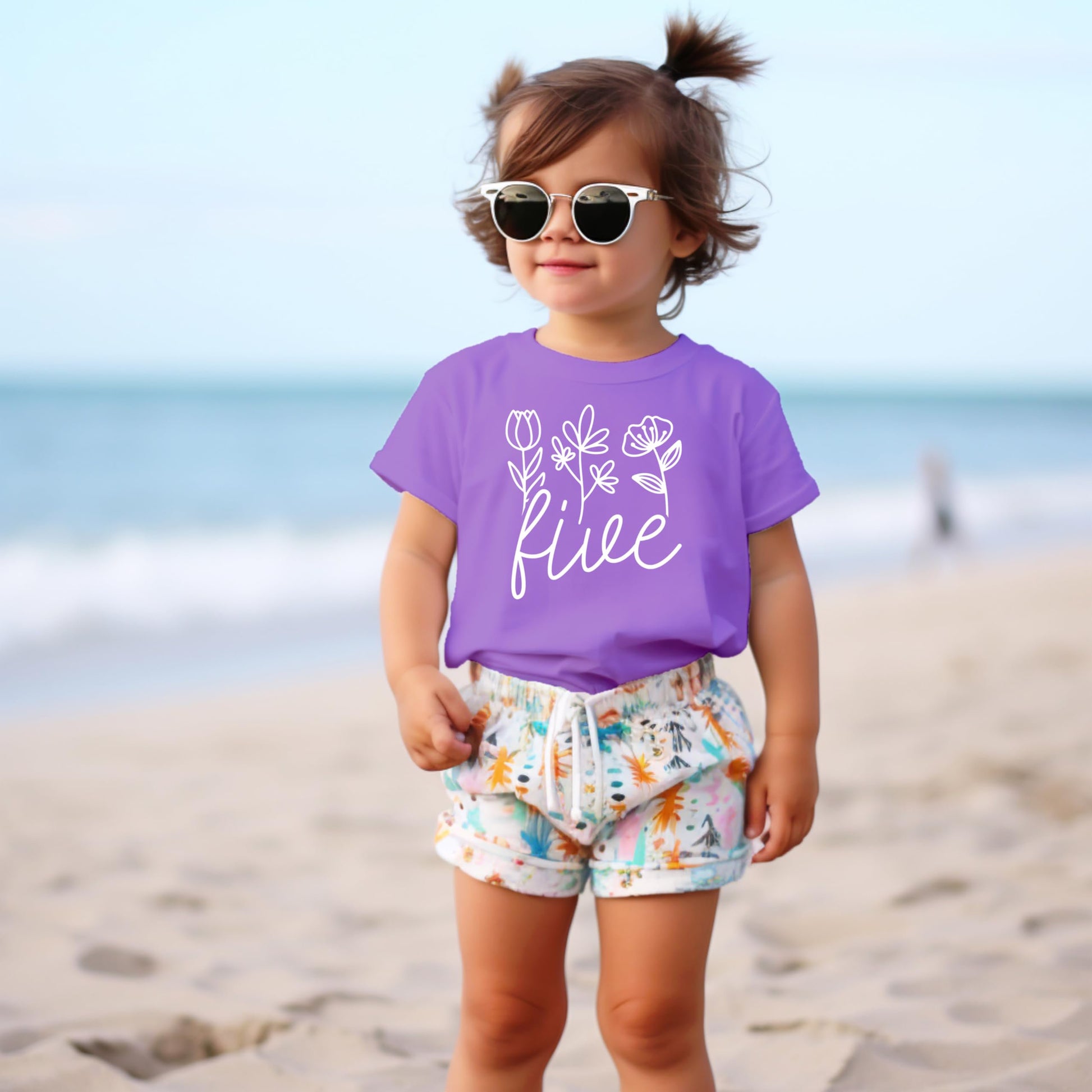 Side view of toddler fifth birthday shirt with floral Five design on military green