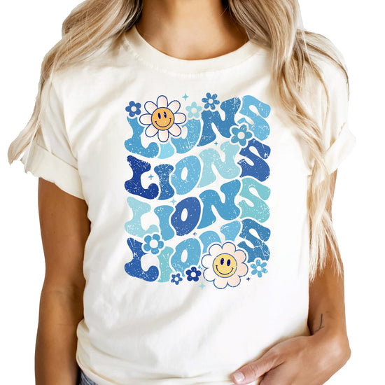 Close-up of blue Lions mascot graphic print on natural colored shirt