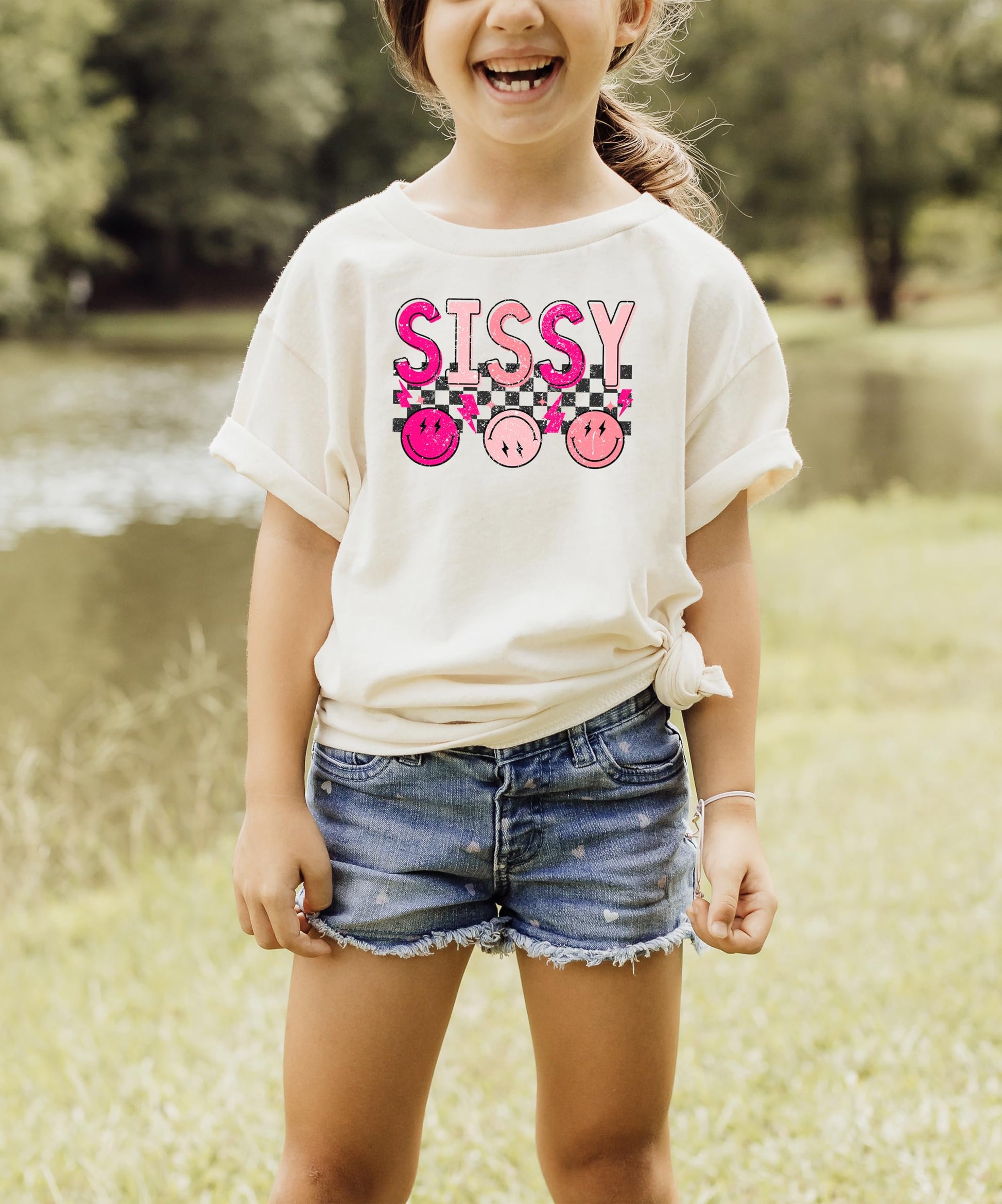 Girls wearing matching sibling Sissy graphic tee in pink retro design