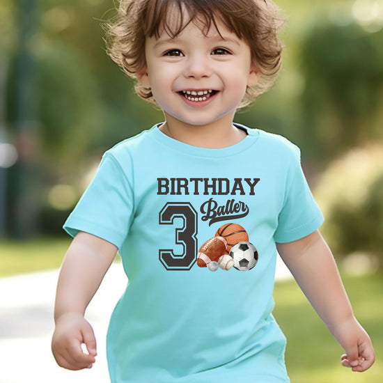 Detail shot of professional USA-printed Birthday Baller graphic on boys toddler tee