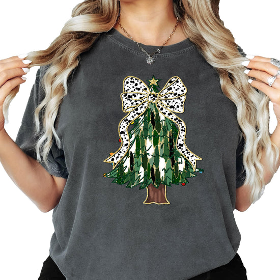 Lifestyle view of festive Christmas tree dalmatian bow graphic tee styled for holiday season