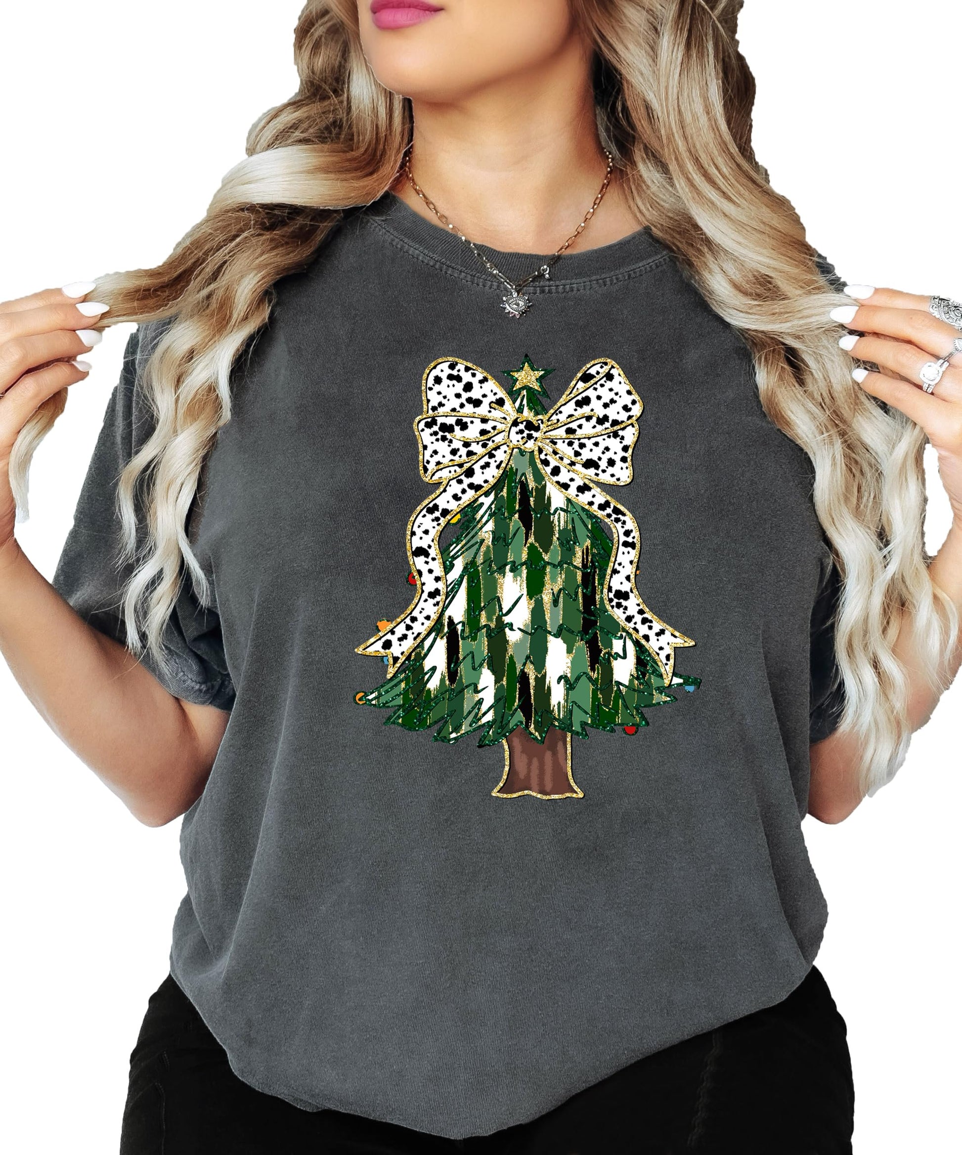 Lifestyle view of festive Christmas tree dalmatian bow graphic tee styled for holiday season