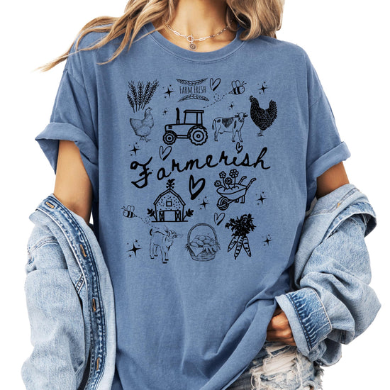 Close-up of hand-drawn farm theme graphic print on a soft women's t-shirt