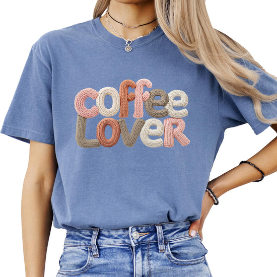 Detail shot of faux yarn-patch coffee lover print on women's graphic tee