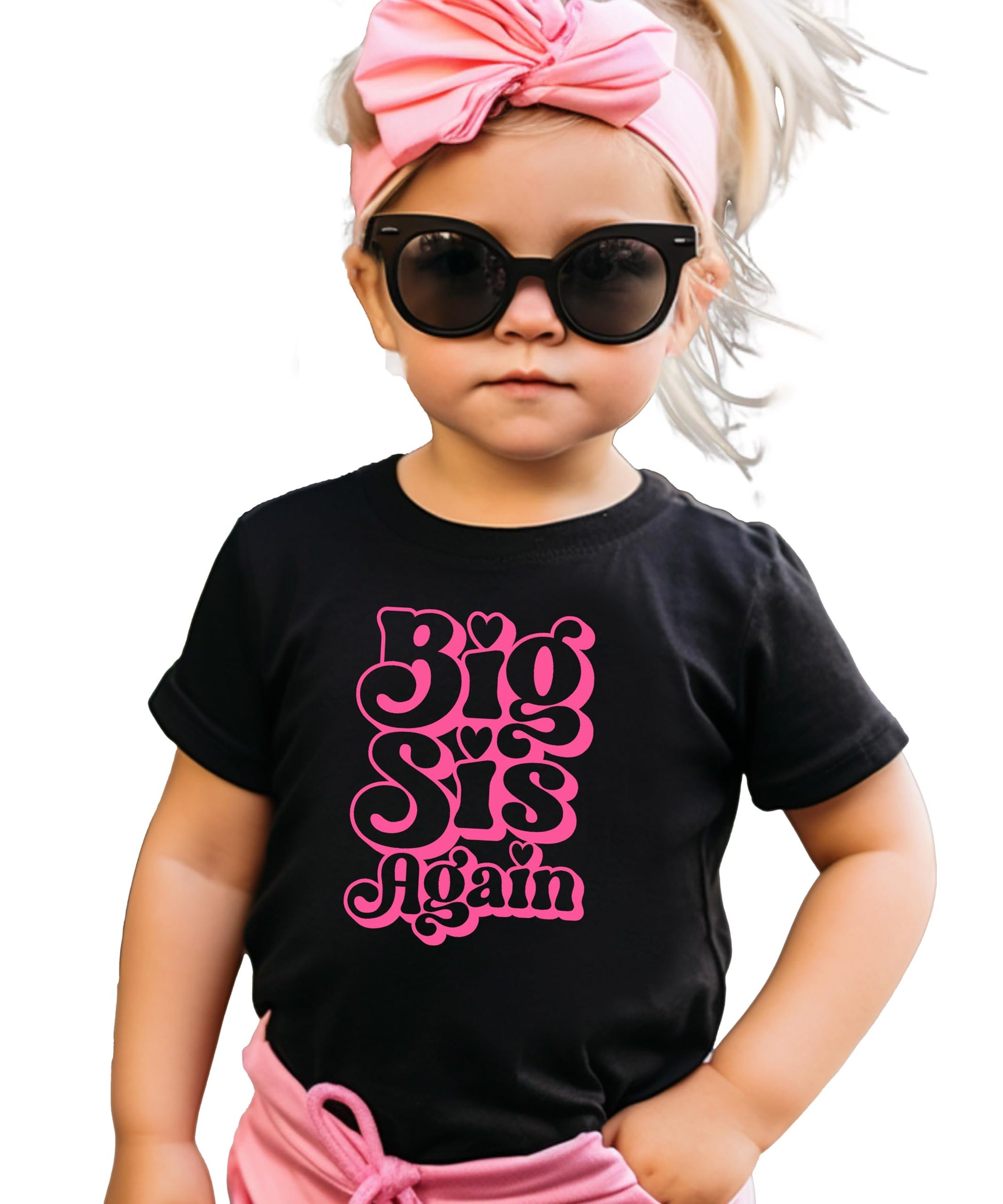 Close-up of Big Sis Again groovy pink heart graphic on natural kids shirt