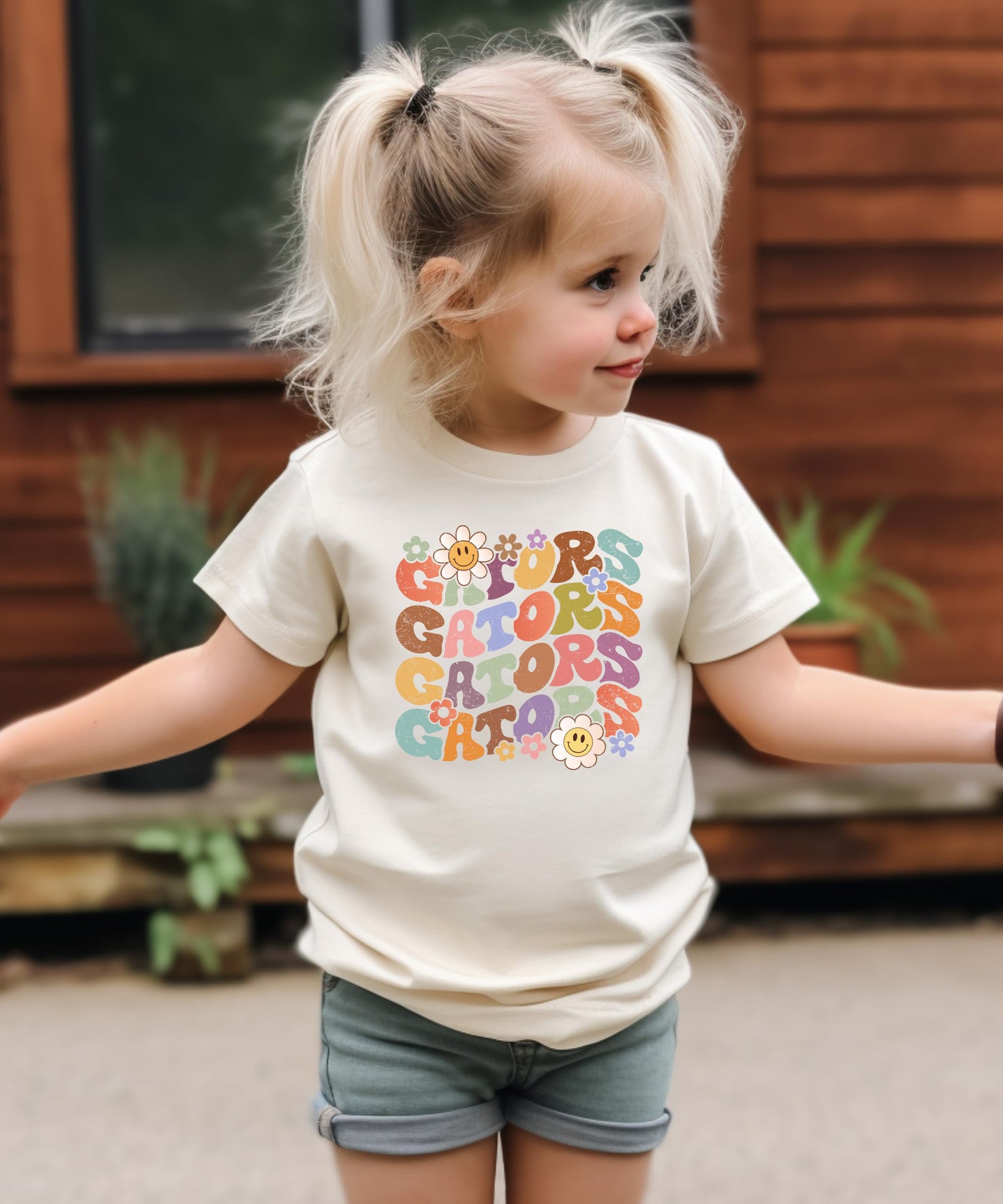 Side or lifestyle view of Gators groovy colorful sports graphic tee for women and kids