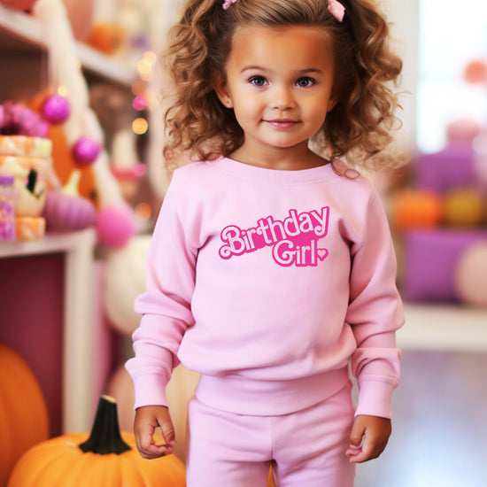 Youth pink Birthday Girl sweatshirt laid flat showing full design