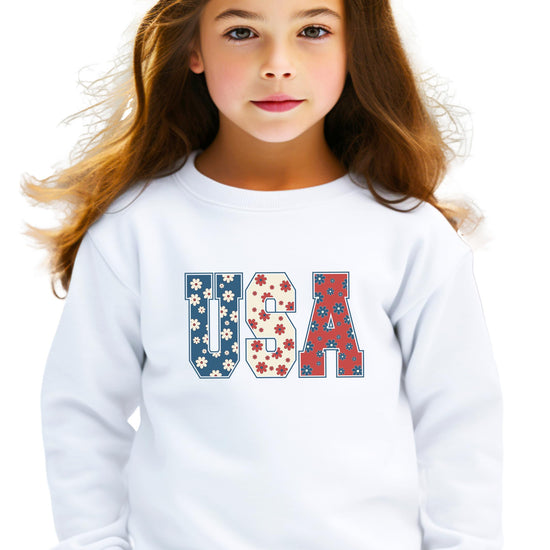 Flat lay of white Floral USA sweatshirt with girly red white and blue graphic print