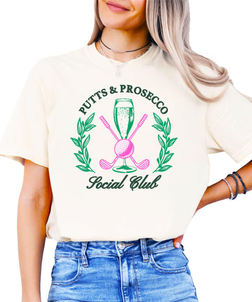 Putts and Pros Social Club ivory graphic tee for women with girly golf and wine lover design