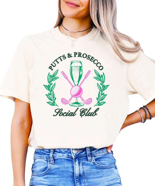 Putts and Pros Social Club ivory graphic tee for women with girly golf and wine lover design