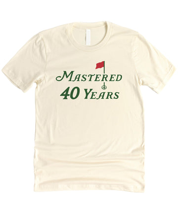 Detail shot of the Mastered 40 Years graphic on a soft unisex birthday tee
