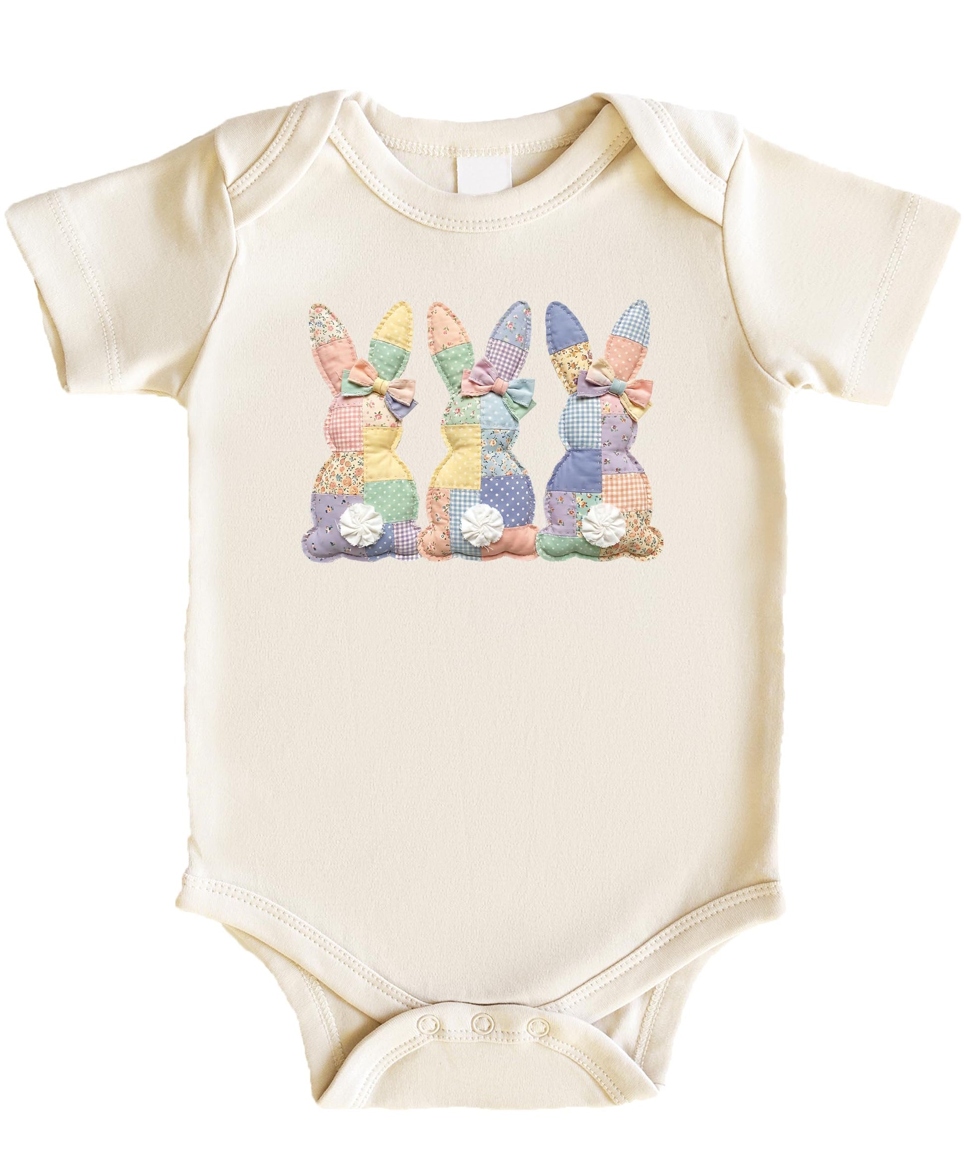 Flat lay of 3 bunnies quilt baby bodysuit in natural cotton color with snap bottom