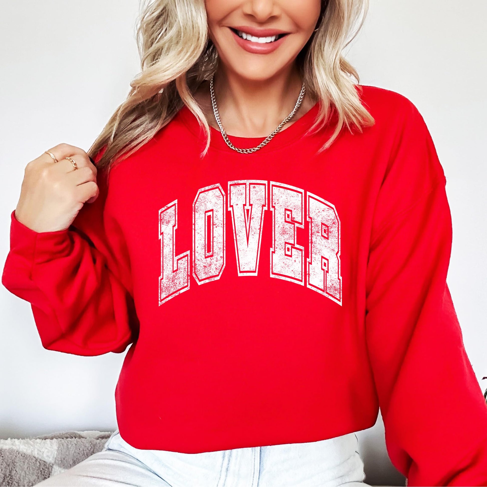 Lover sweatshirt detail shot showing print quality and distressed varsity lettering
