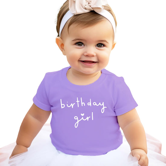 Detail shot of white Birthday Girl heart print on military green youth graphic t-shirt