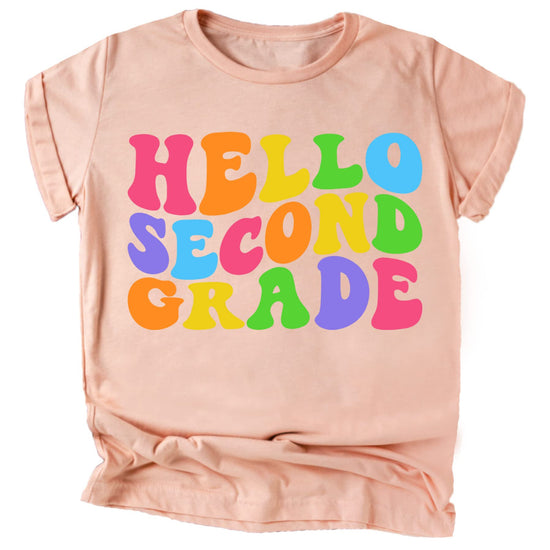 Close-up of wavy Hello 2nd Grade print on purple kids graphic tee