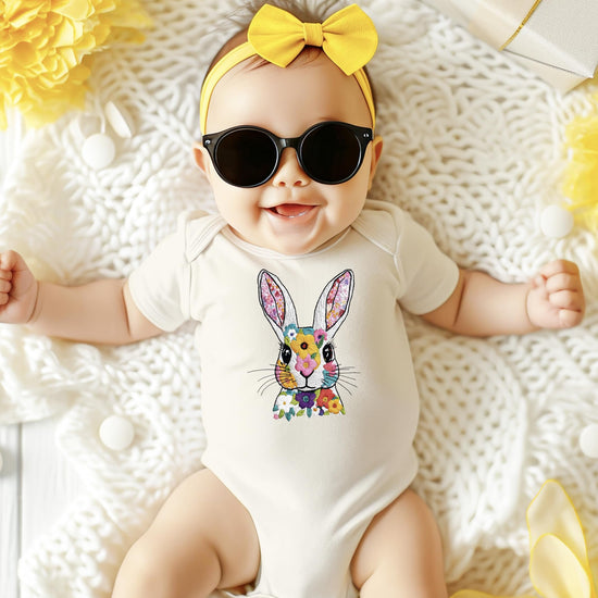 Front view of Easter bunny baby bodysuit laid flat showing spring floral bunny design