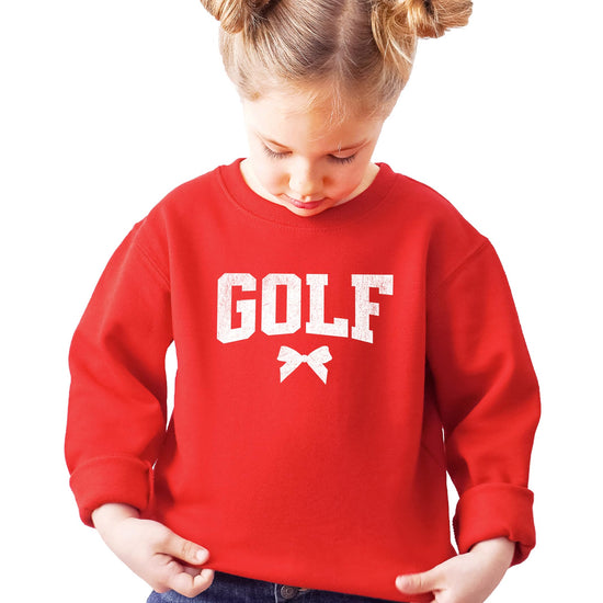 Lifestyle or detail shot of trendy coquette bow golf sweatshirt in red