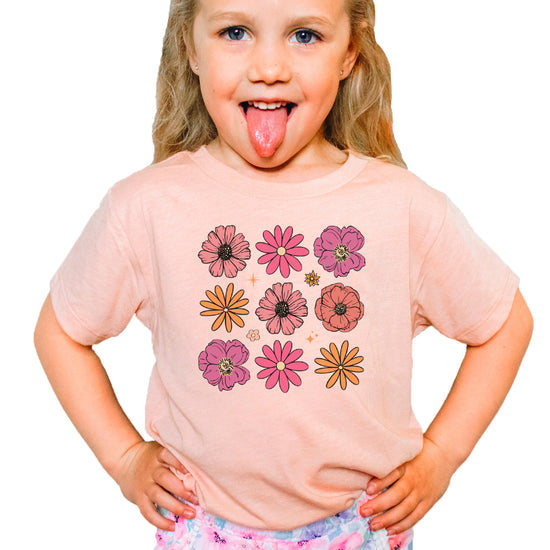 Close-up of bright floral graphic print on soft natural kids t-shirt
