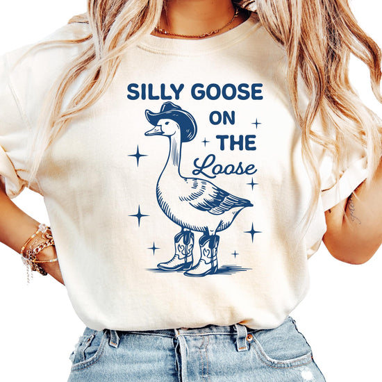 Close-up of Silly Goose on the Loose graphic print design on ivory shirt