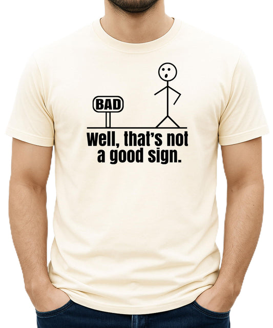 Close-up view of stick figure bad sign humor graphic print on men's t-shirt