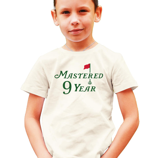 Kids natural color t-shirt with 'Mastered 9 Years' golf graphic design for 9th birthday