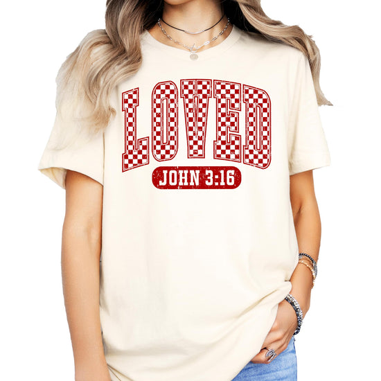 Lifestyle photo of women wearing red check Loved Christian graphic Valentine's Day tee