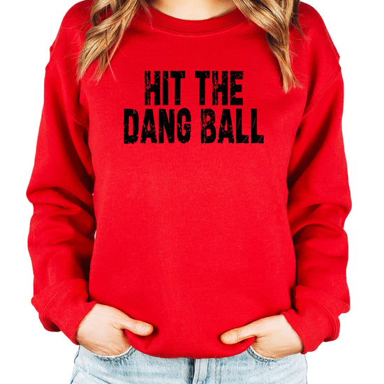Women's red crewneck sweatshirt with distressed Hit The Dang Ball baseball graphic printed on front