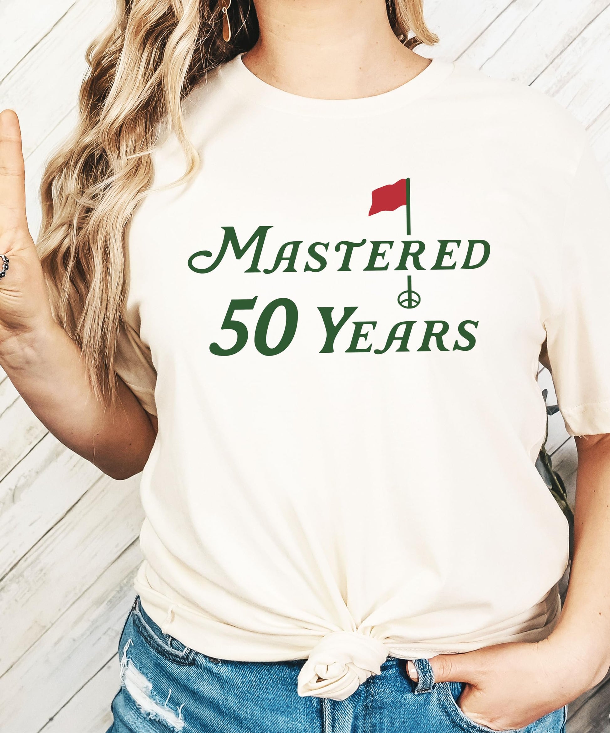 Close-up of vibrant golf-themed print on the Mastered 50 Years birthday shirt