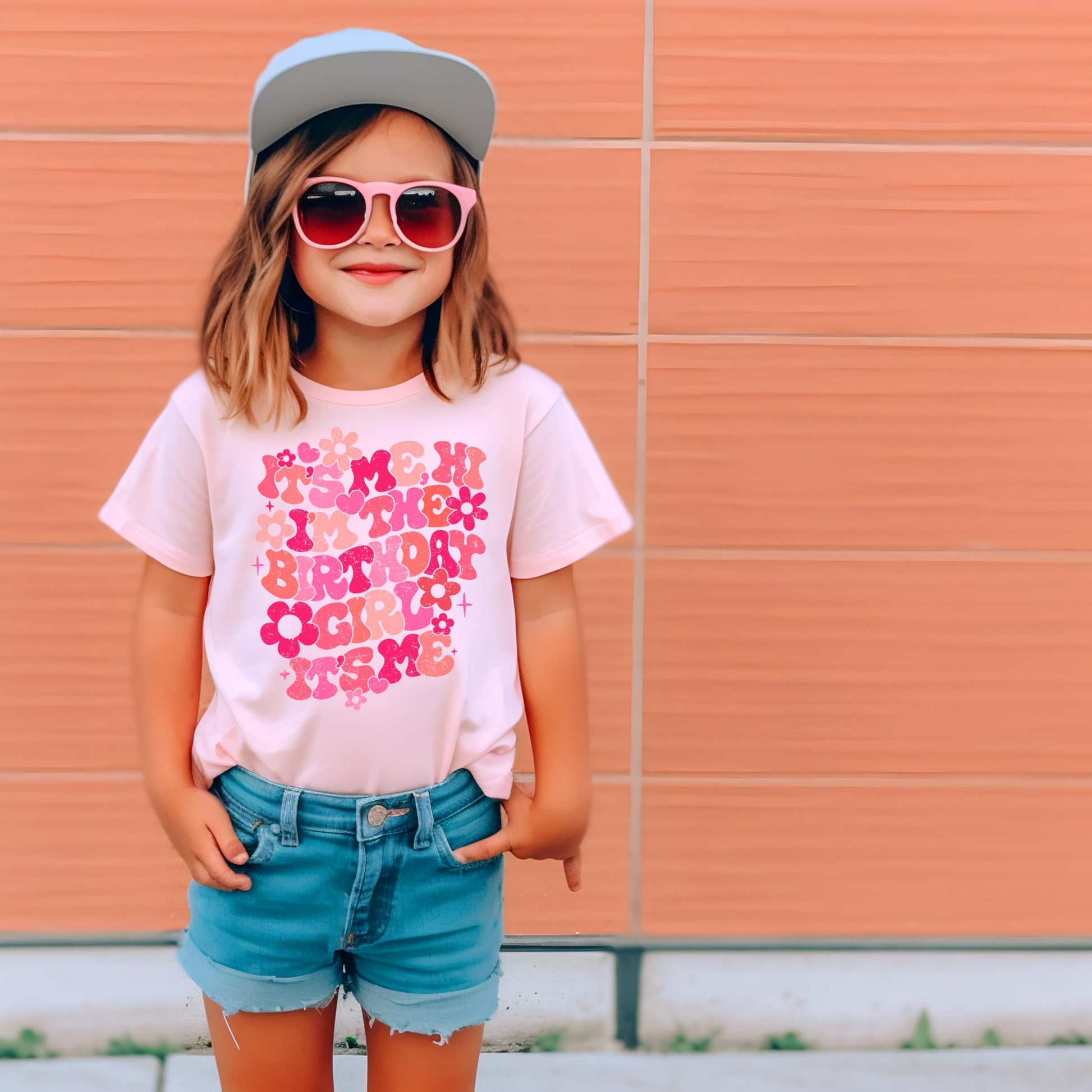 Lifestyle photo of girl in It's Me Hi It's My Birthday peach floral birthday shirt