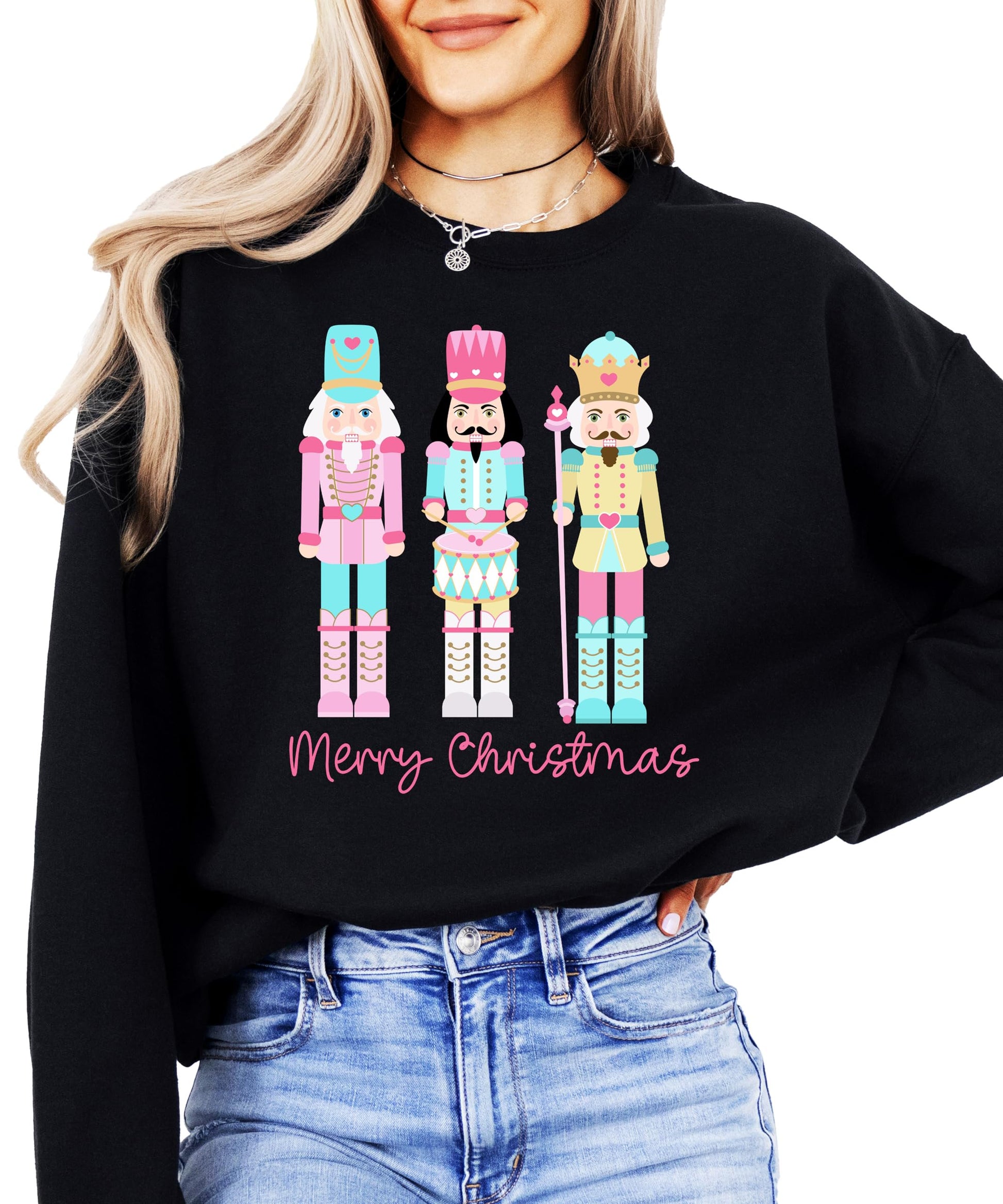 Black Christmas sweatshirt featuring whimsical pastel nutcracker and festive holiday text