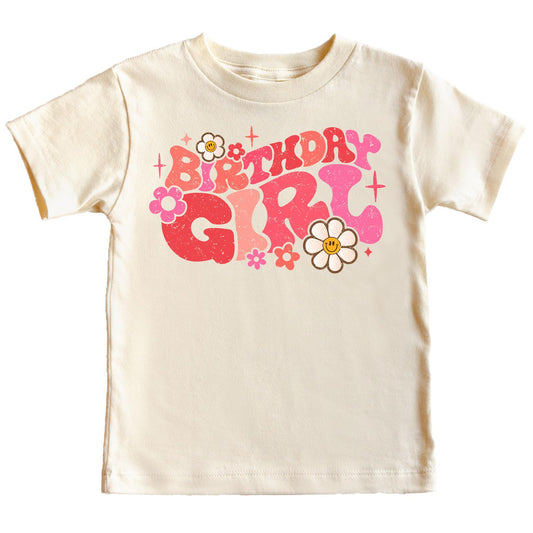 Close-up of groovy daisy birthday girl graphic print on natural kids tee
