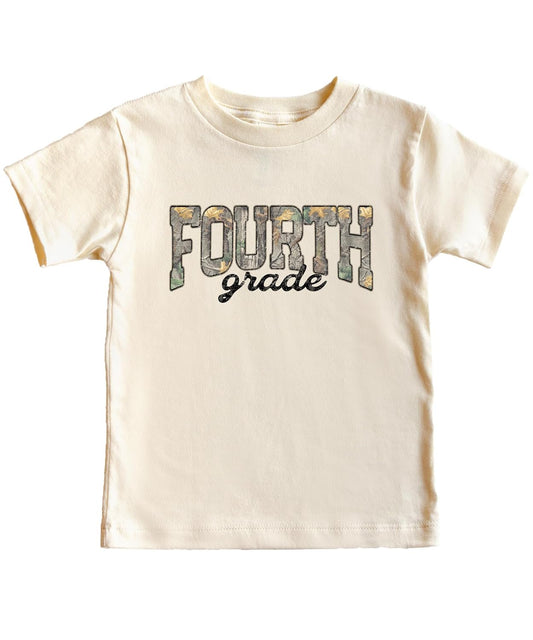 Close-up of Fourth Grade camo shirt design showing woodland leaf print lettering and script accent