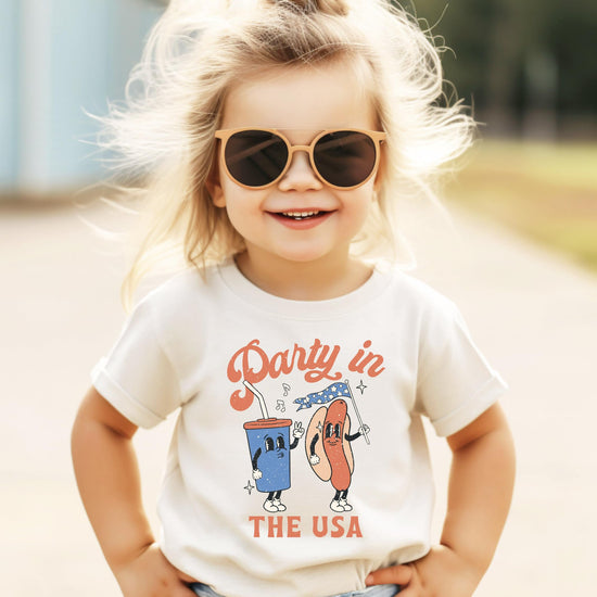 Collection of Party in the USA shirts in various colors and sizes displayed together