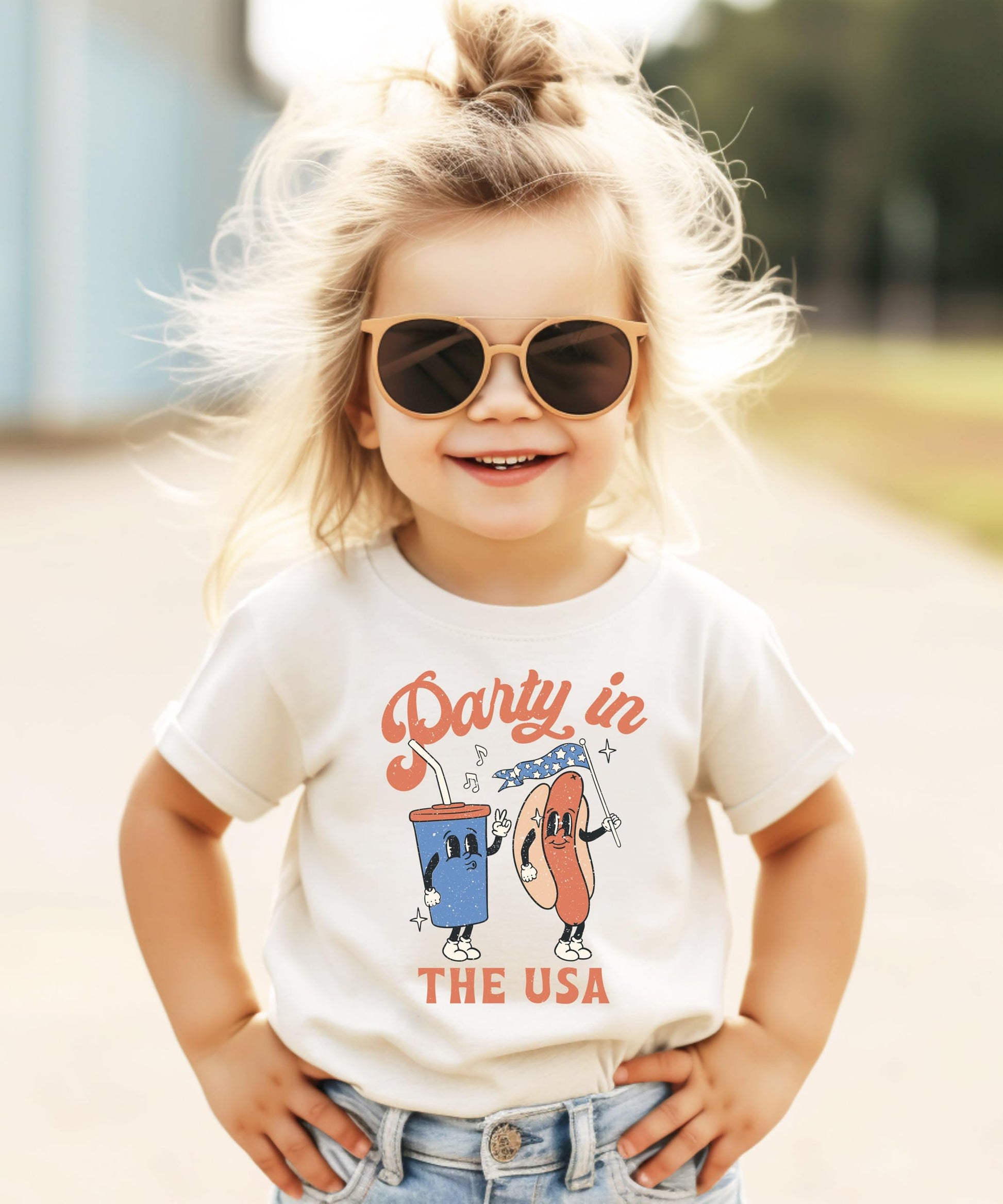 Collection of Party in the USA shirts in various colors and sizes displayed together