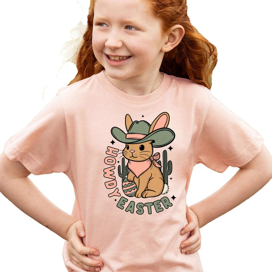 Girls wearing Howdy Easter western graphic tee, showing relaxed fit and vibrant spring print