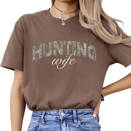 Close-up of hunting wife graphic print on women's camouflage t-shirt