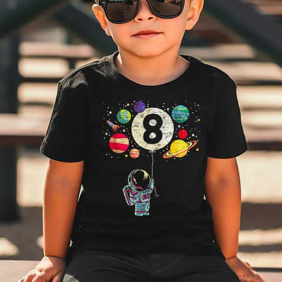 Back view of kids space birthday graphic tee with planet and rocket details
