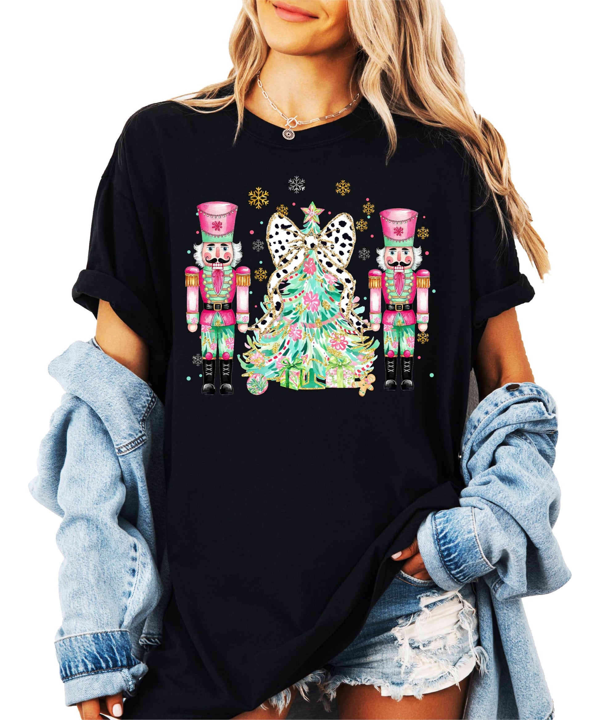 Detail shot of professional printed nutcracker Christmas tree design on peach holiday t-shirt