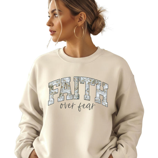 Side view of women's Faith Over Fear pullover sweatshirt in army green