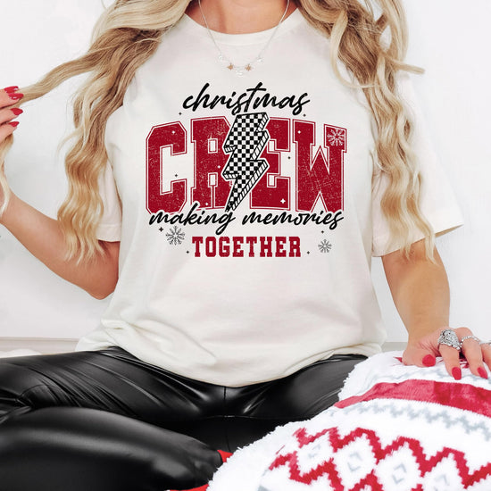 Front view of Christmas Crew 2024 holiday graphic tee featuring trendy checkered design on natural shirt