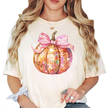 Women's seafoam green t-shirt featuring a disco ball pumpkin with a pink coquette bow graphic for Halloween