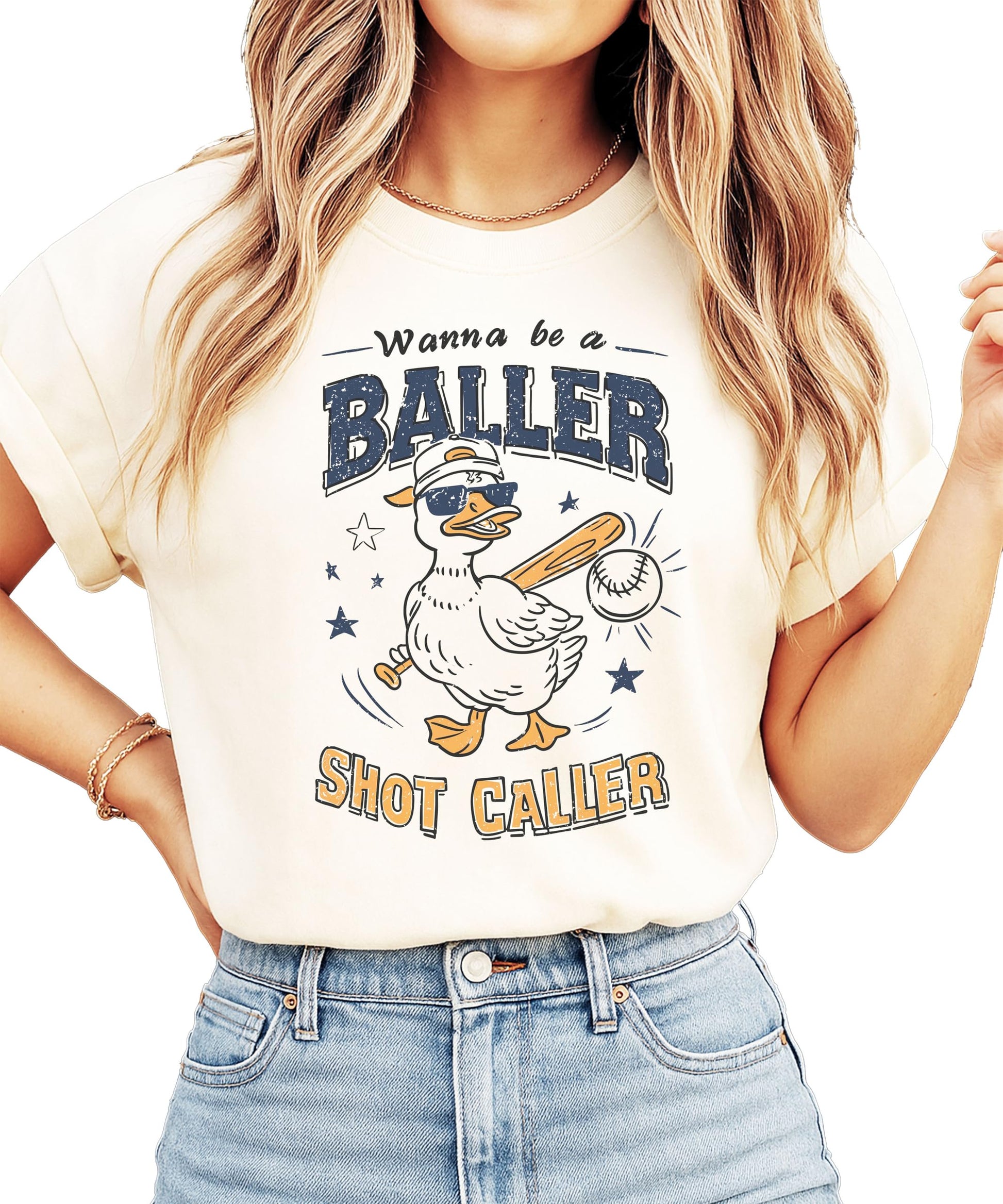 Model wearing ivory baseball themed graphic tee with funny duck baller design