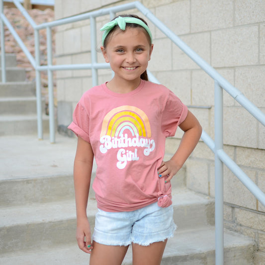 Side view of retro rainbow birthday girl shirt showing fit and design