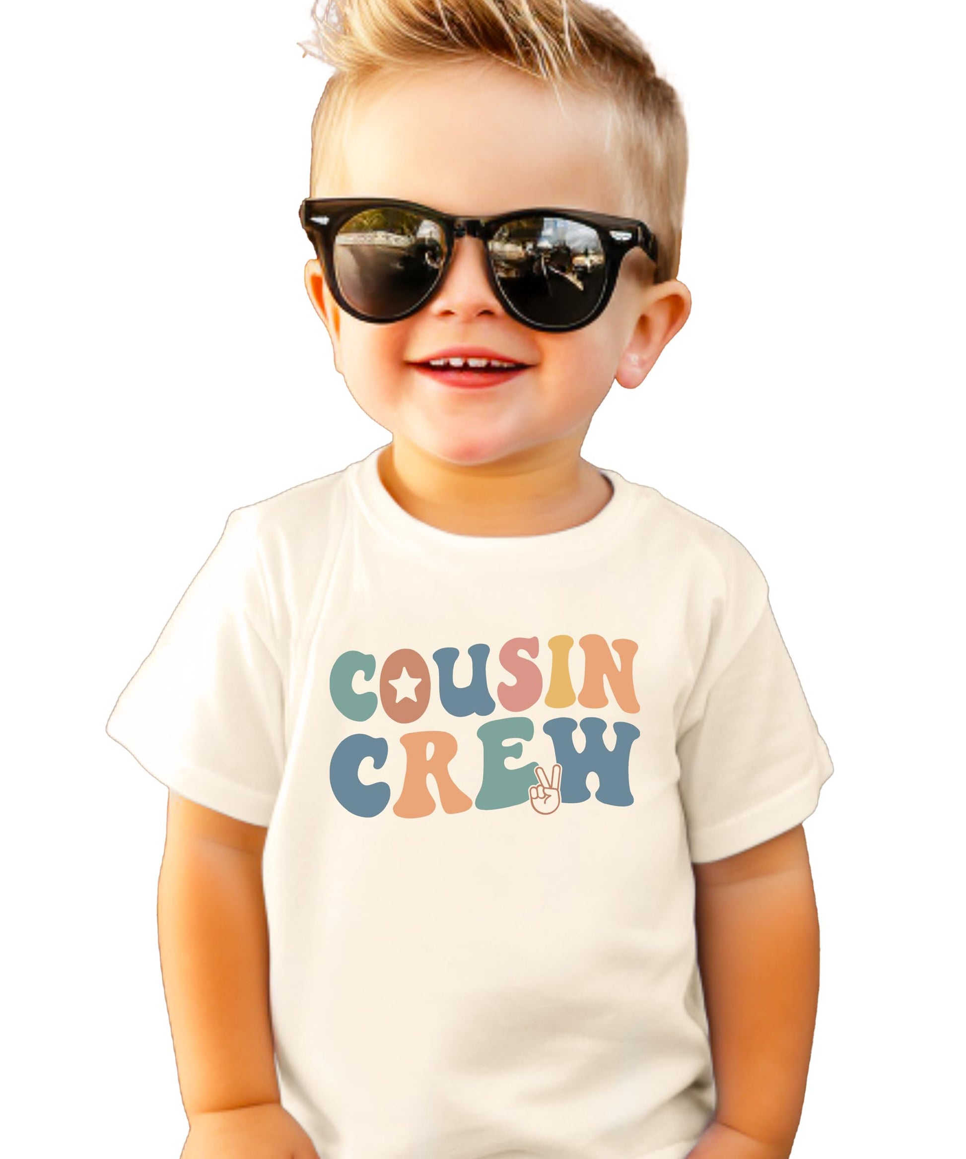 Natural colored kids t-shirt with colorful retro Cousin Crew text and peace sign design