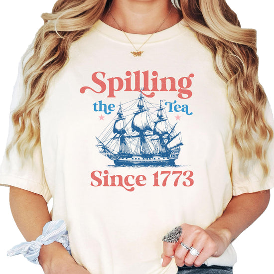 Close-up view of the tea-themed American Revolution graphic print on ivory shirt