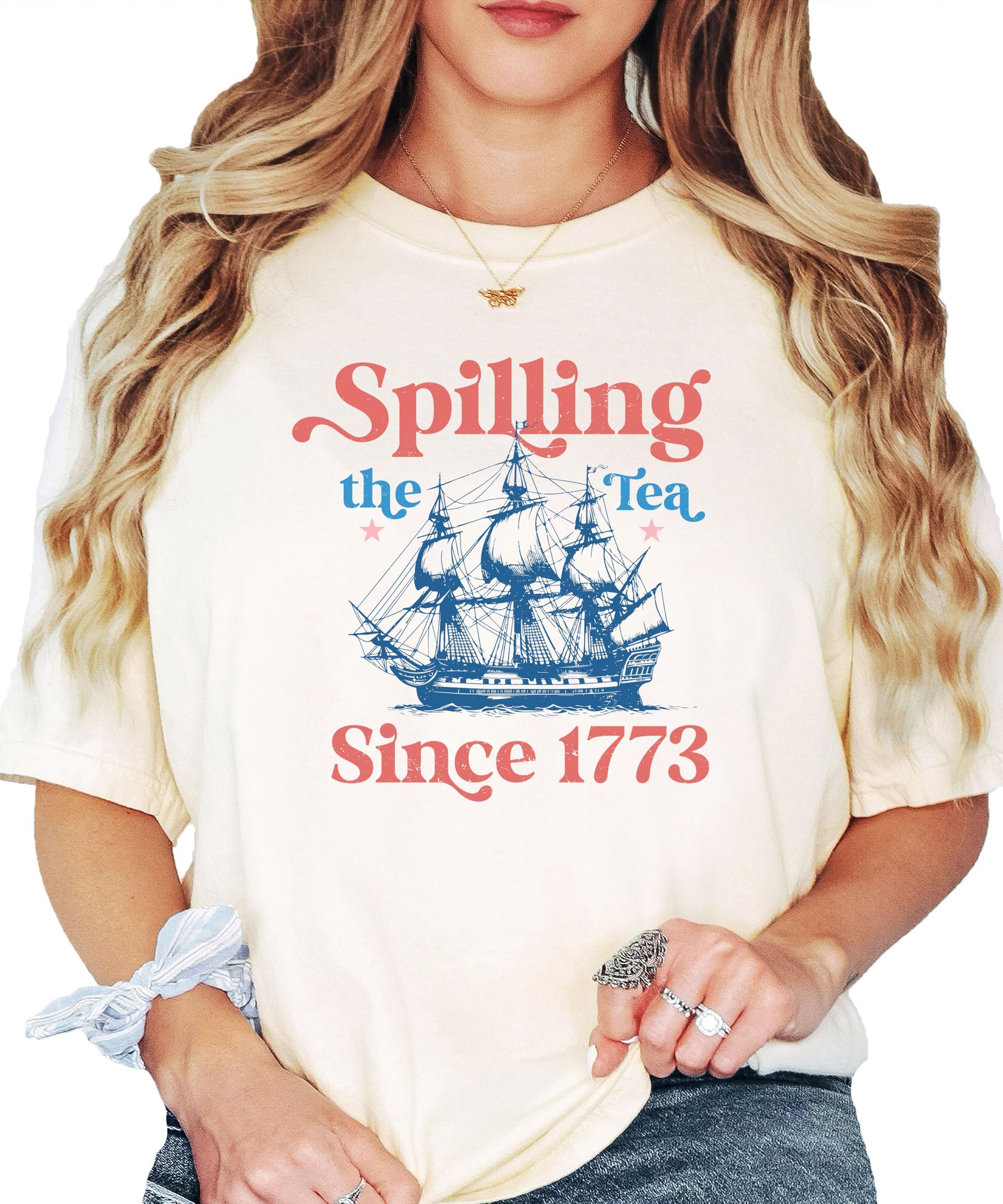 Close-up view of the tea-themed American Revolution graphic print on ivory shirt