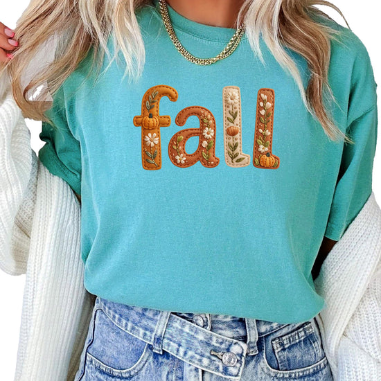 Fall floral tee styling shot showing relaxed fit and autumn graphics